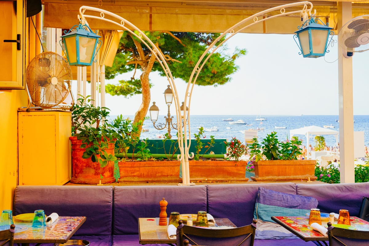 Amalfi coast 02 POSITANO-terrace-of-luxury-street-cafe-in- - From the 20th century, Positano has become the holiday resort of an elite group of intellectuals, artists and celebrities