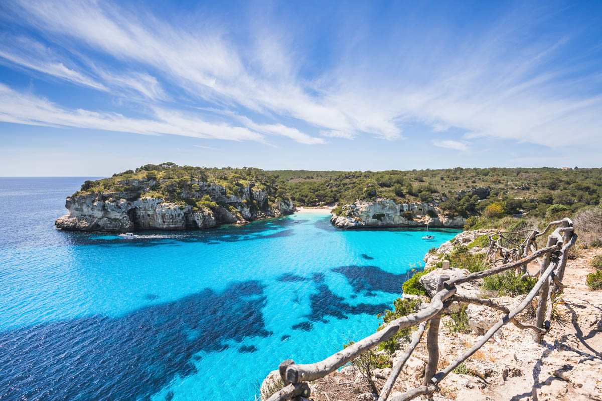 Beautiful bay with sandy beach and sailing boats, Menorca island, Spain - Beautiful bay with sandy beach in Menorca 